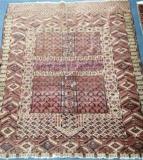 A Bokhara red ground rug 125 x 150cm